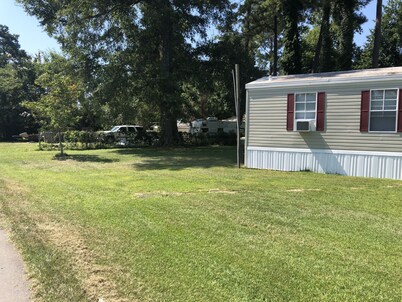Near the water  and close to a  boat ramp