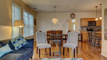 Flat-screen TV, video-game console, books, video library