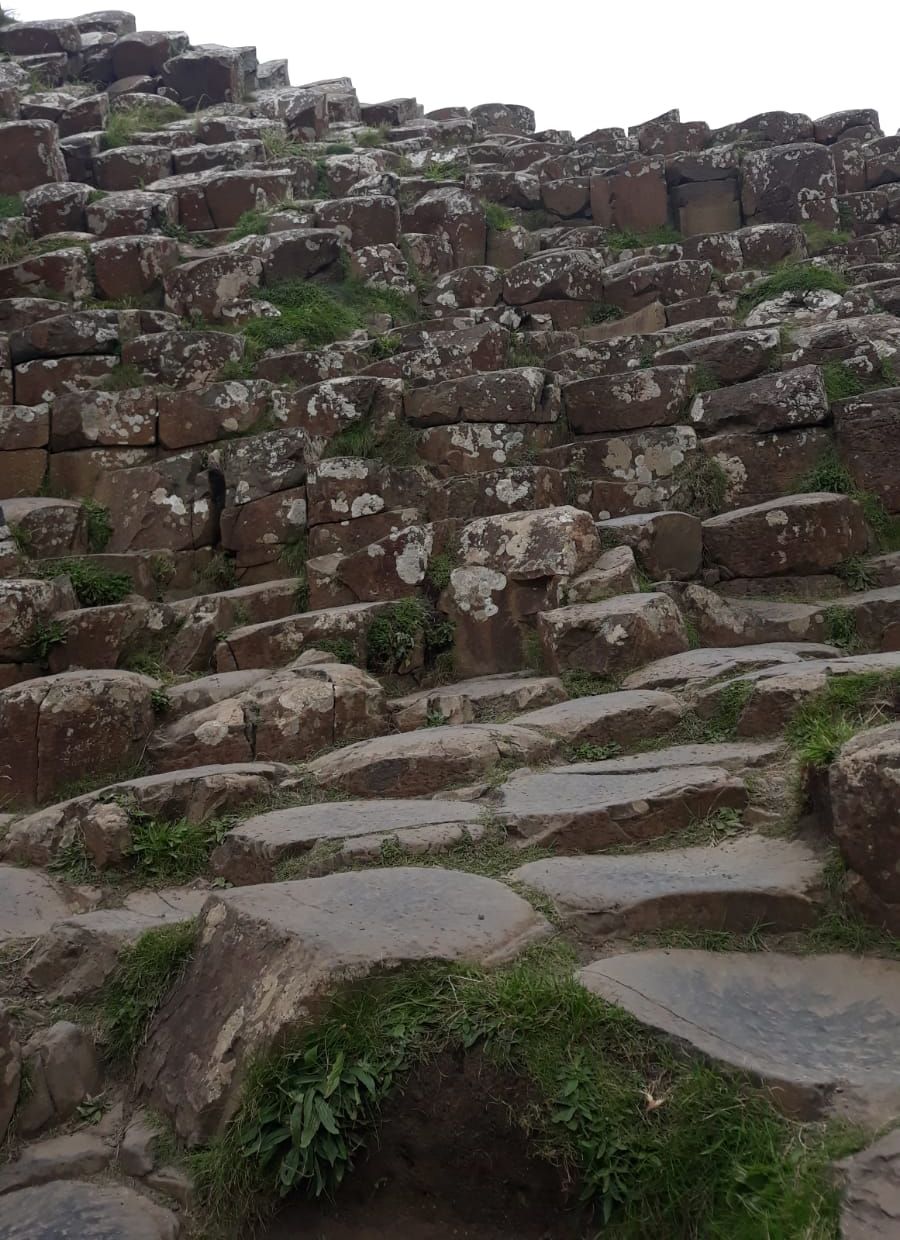 A large, ancient stone structure with irregularly shaped stones stacked in a haphazard manner.