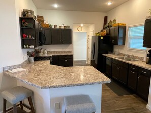 Coffee/tea maker, fridge, microwave, oven