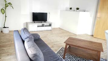 Family Apartment | Living area | 40-inch LED TV with satellite channels, TV