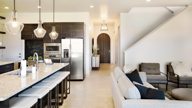 A modern kitchen with a central island, stainless steel appliances, and pendant lighting. - Arcadia 30 | PAC-MAN * Asteroids Arcade * Games * Balcony Views * Resort Ameniti (Santa Clara)