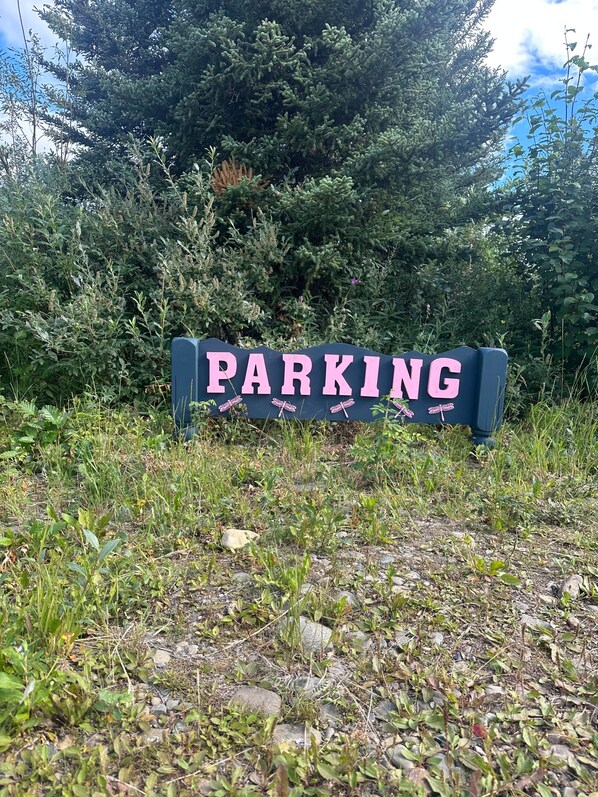 A sign with the word 'PARKING' and decorative elements.