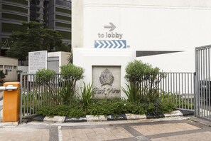 A gated entrance with a sign directing to the lobby, a notice about vehicle parking, and the name 'Park View'. - Parkview at KLCC (Kuala Lumpur)