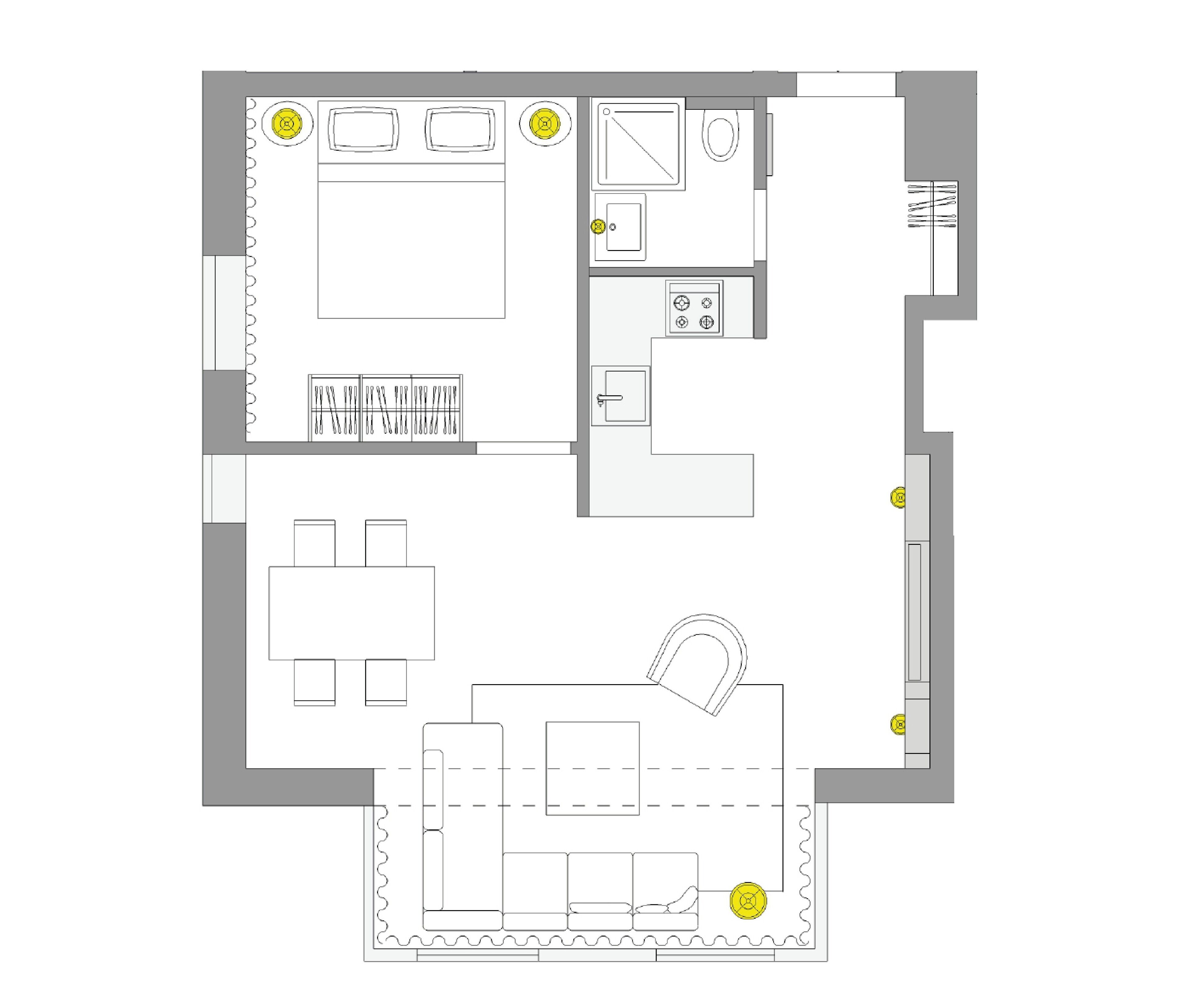 A floor plan of a hotel room with a kitchenette, a dining area, a bathroom, and a living area.