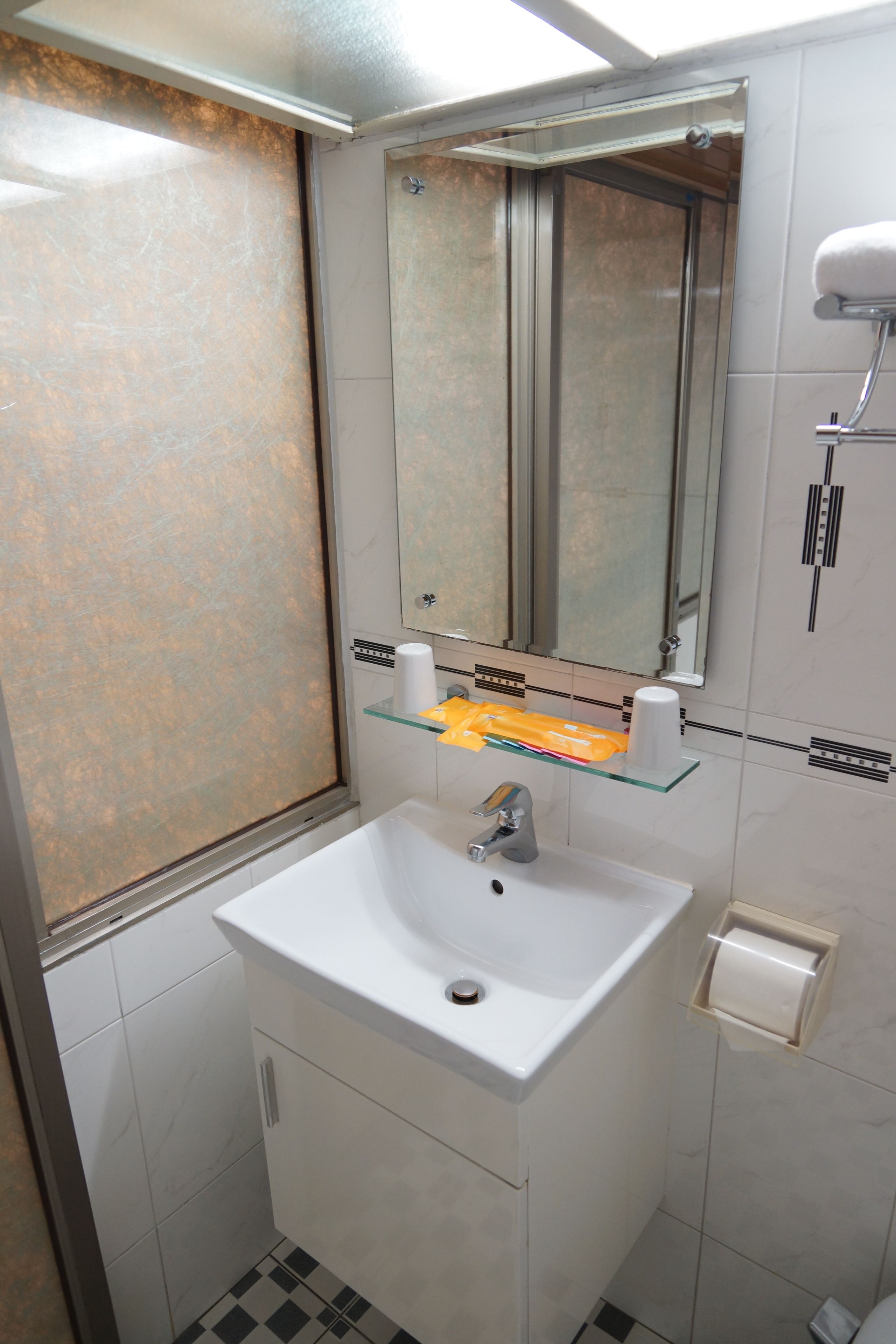 standard double room | bathroom | rainfall showerhead, hair dryer, slippers, towels