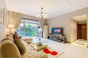 Comfort Apartment (Mainland Chinese Citizen Only) | Living room | LCD TV