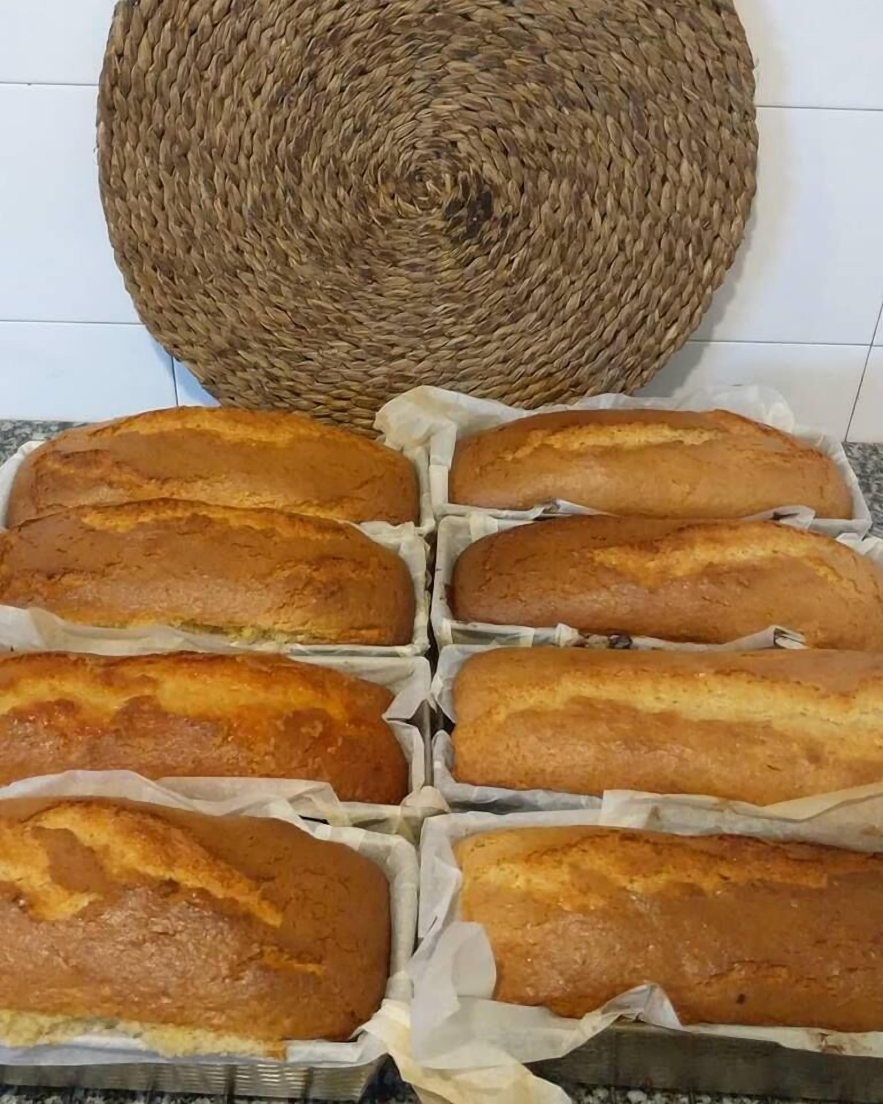 A tray of freshly baked bread on a kitchen counter.