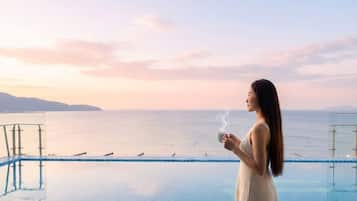 Outdoor pool, open 6:00 AM to 10:00 PM, pool umbrellas, pool loungers