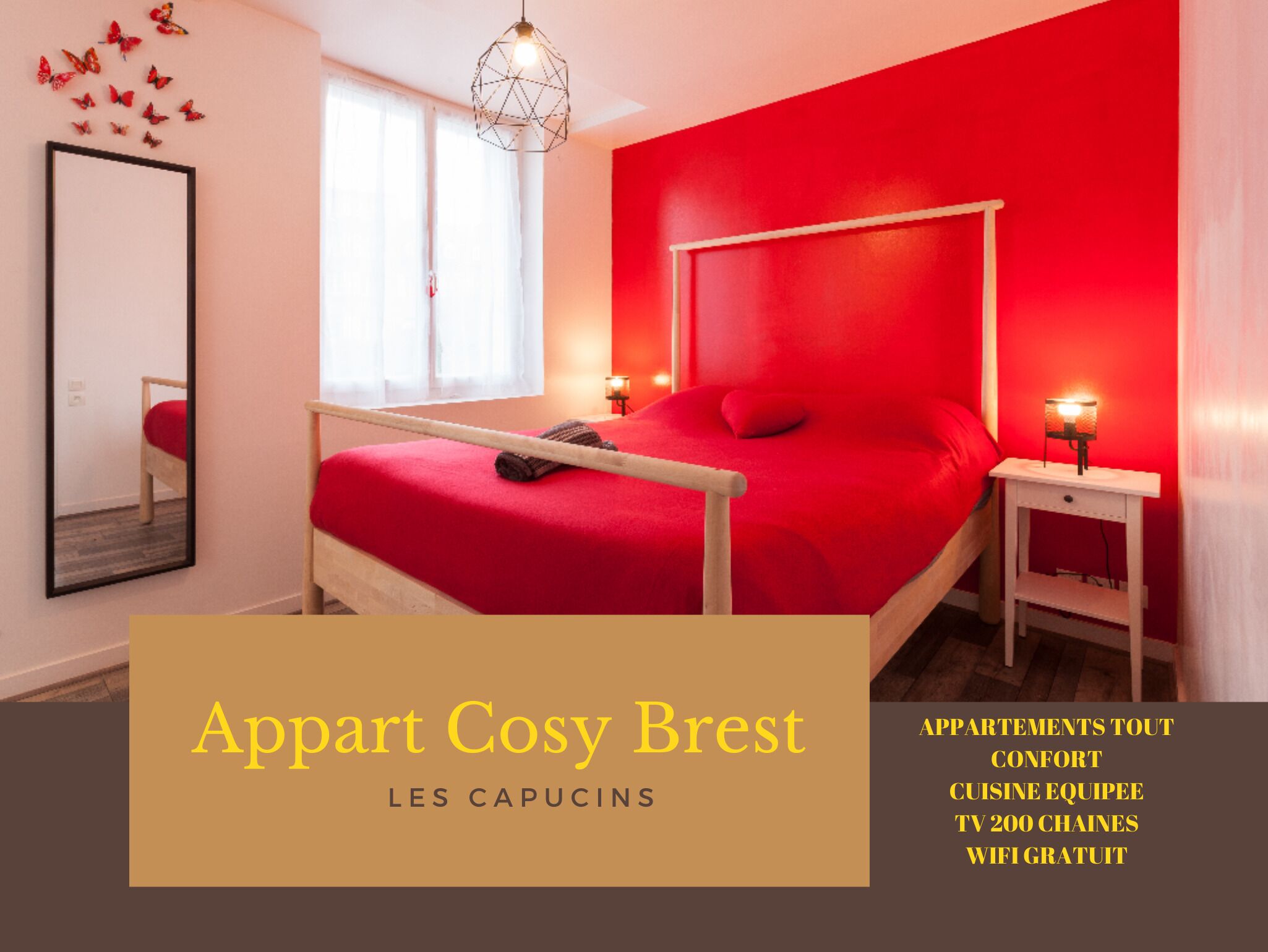A modern bedroom with a red bed, a white headboard, and a bedside table with a lamp.
