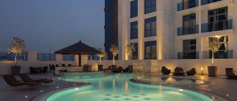 Outdoor pool, open 8:00 AM to 8:00 PM, pool umbrellas