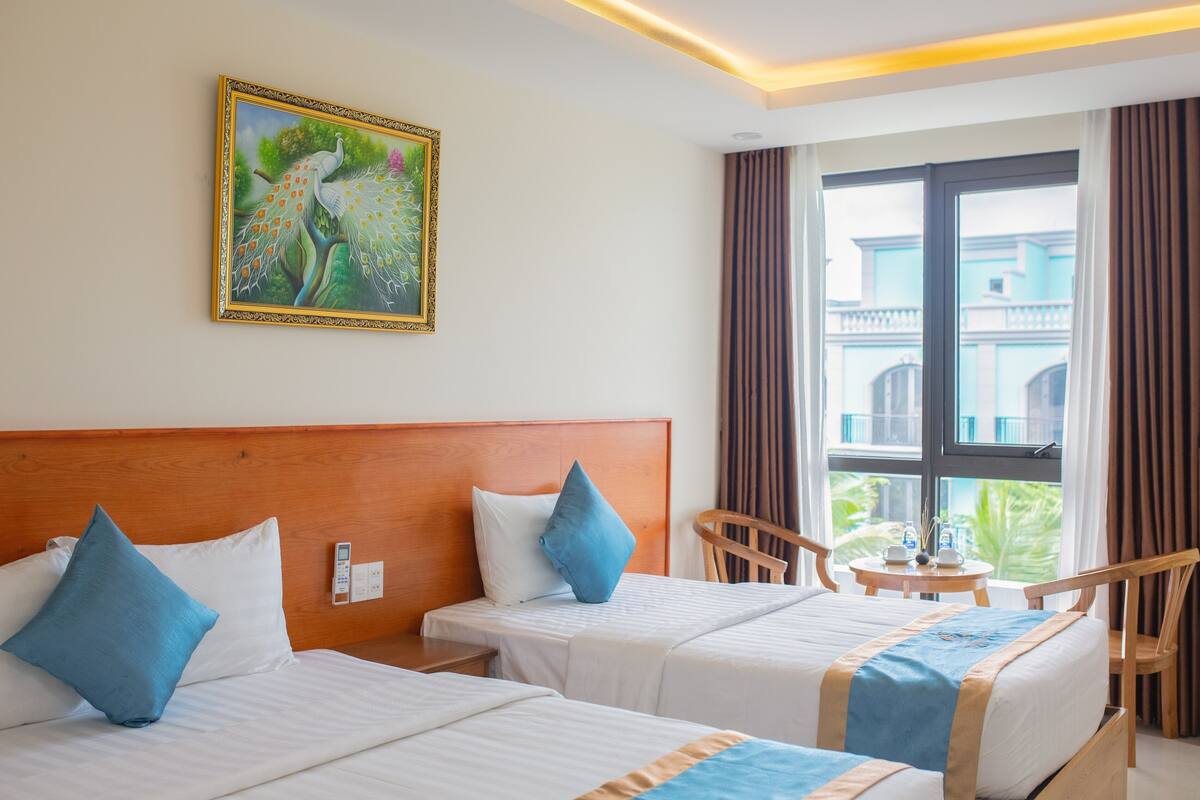 Memory-foam beds, minibar, desk, laptop workspace