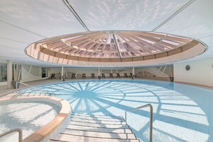 Indoor pool, open 7:00 AM to 9:00 PM, pool loungers