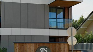 A modern building with a sign for "Regent Suites."