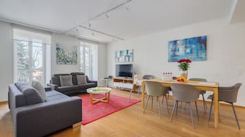 Deluxe Apartment, 3 Bedrooms, Lake View (Third Floor) | Living area | Flat-screen TV