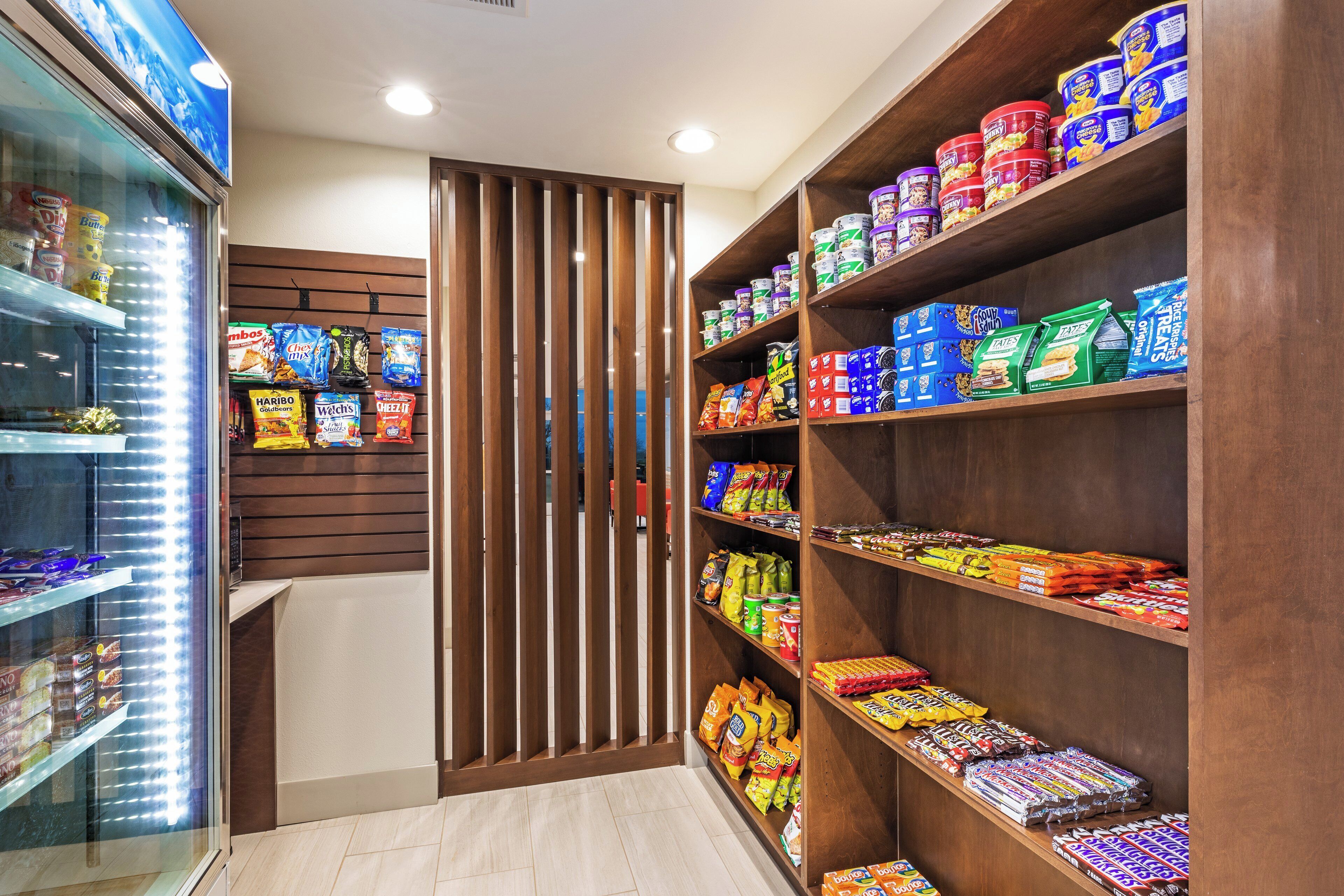 A snack aisle with various packaged foods and beverages.
