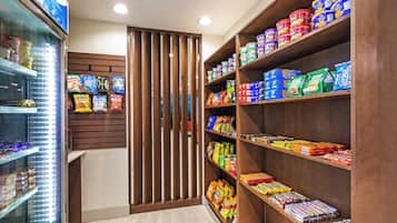 A snack aisle with various packaged foods and beverages.