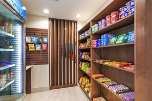A snack aisle with various packaged foods and beverages. - Holiday Inn Express & Suites Purcell by IHG (Purcell)