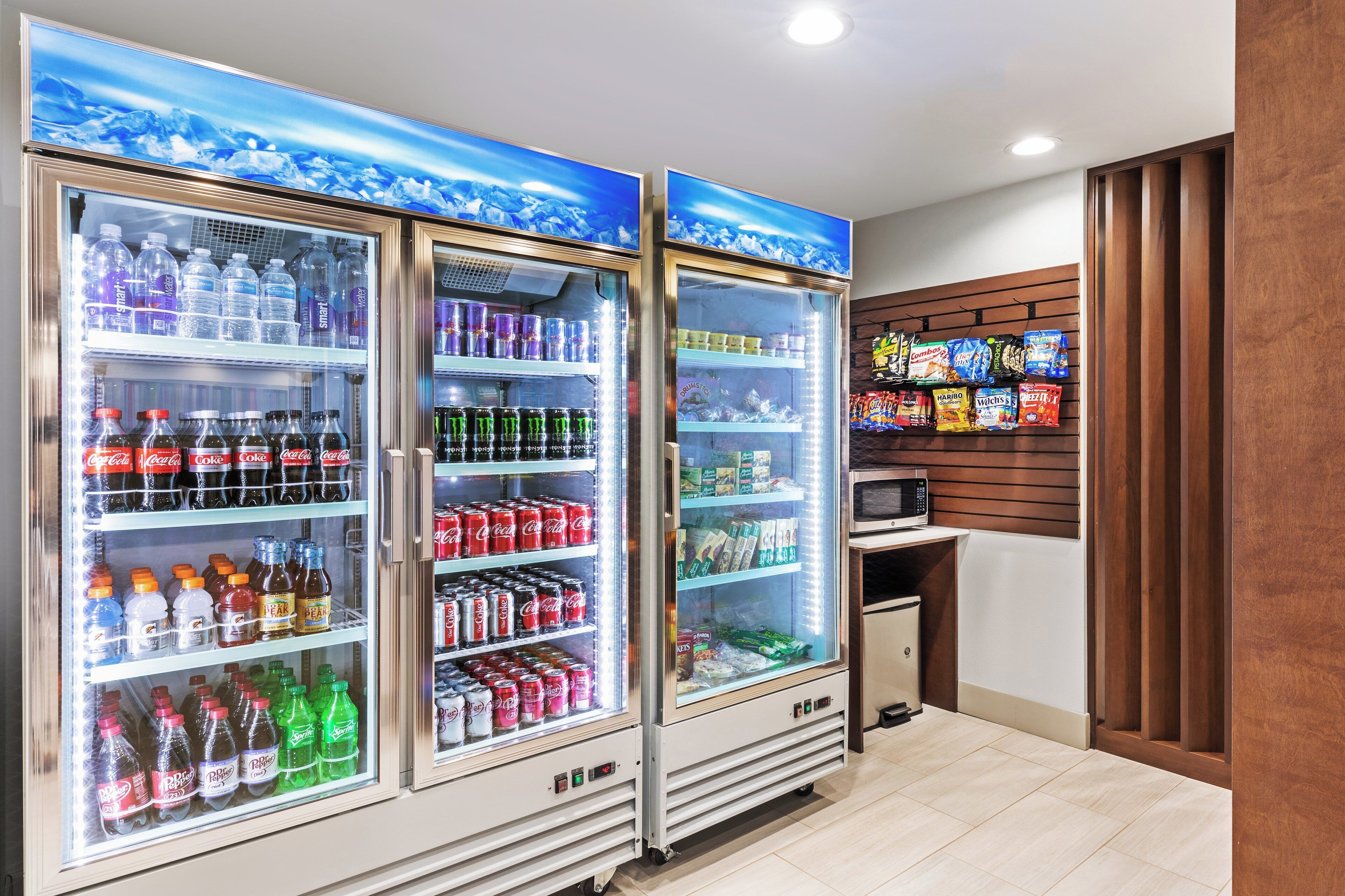 A vending area with various beverage options and snacks.