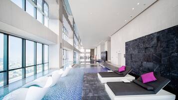 Indoor pool, open 6:00 AM to 11:00 PM, pool loungers, lifeguards on site