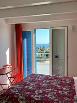 Double Room, Balcony, Sea View | Minibar, in-room safe, desk, laptop workspace