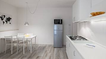 Apartment, 1 Bedroom (Pisano Bilo) | Private kitchenette | Full-size fridge, microwave, stovetop, cookware/dishes/utensils