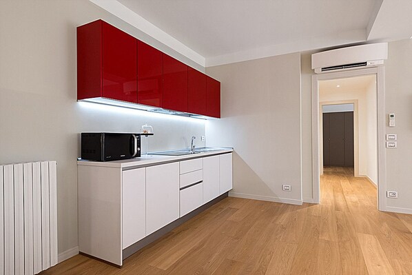 Departamento, 2 habitaciones (Tiziana) | Cocineta privada | Refrigerador con congelador, microondas, parrilla de estufa y tostadora 