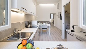 Apartamento, 2 quartos | Área de estar | TV de tela plana