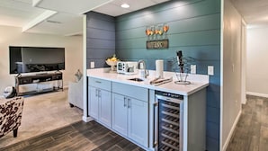 A modern kitchen with a built-in oven, a sink, and a countertop. - Family Home w/ Deck, Yard, Dock on Rock River (Janesville)