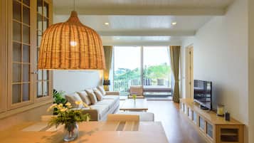 Suite with Lake View | Living room | 42-inch LED TV with cable channels, TV