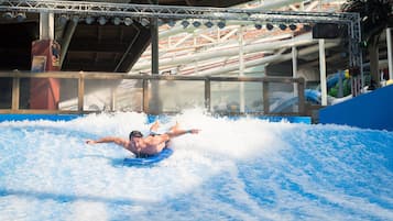 A water slide with a person at the bottom.