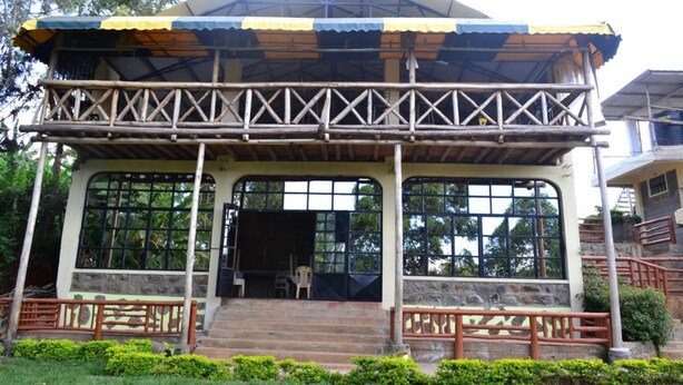 A two-story building with a balcony, large windows, and a covered entrance area. - Scenic View Hotel & Resort (Nairobi)