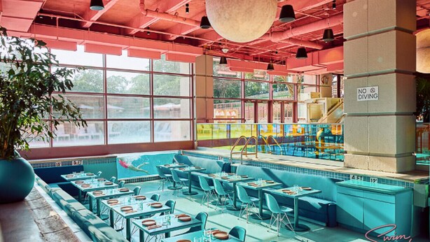 A restaurant with a pool area, tables, and chairs. - Olander xxxxxxxxxxxx (Austin)