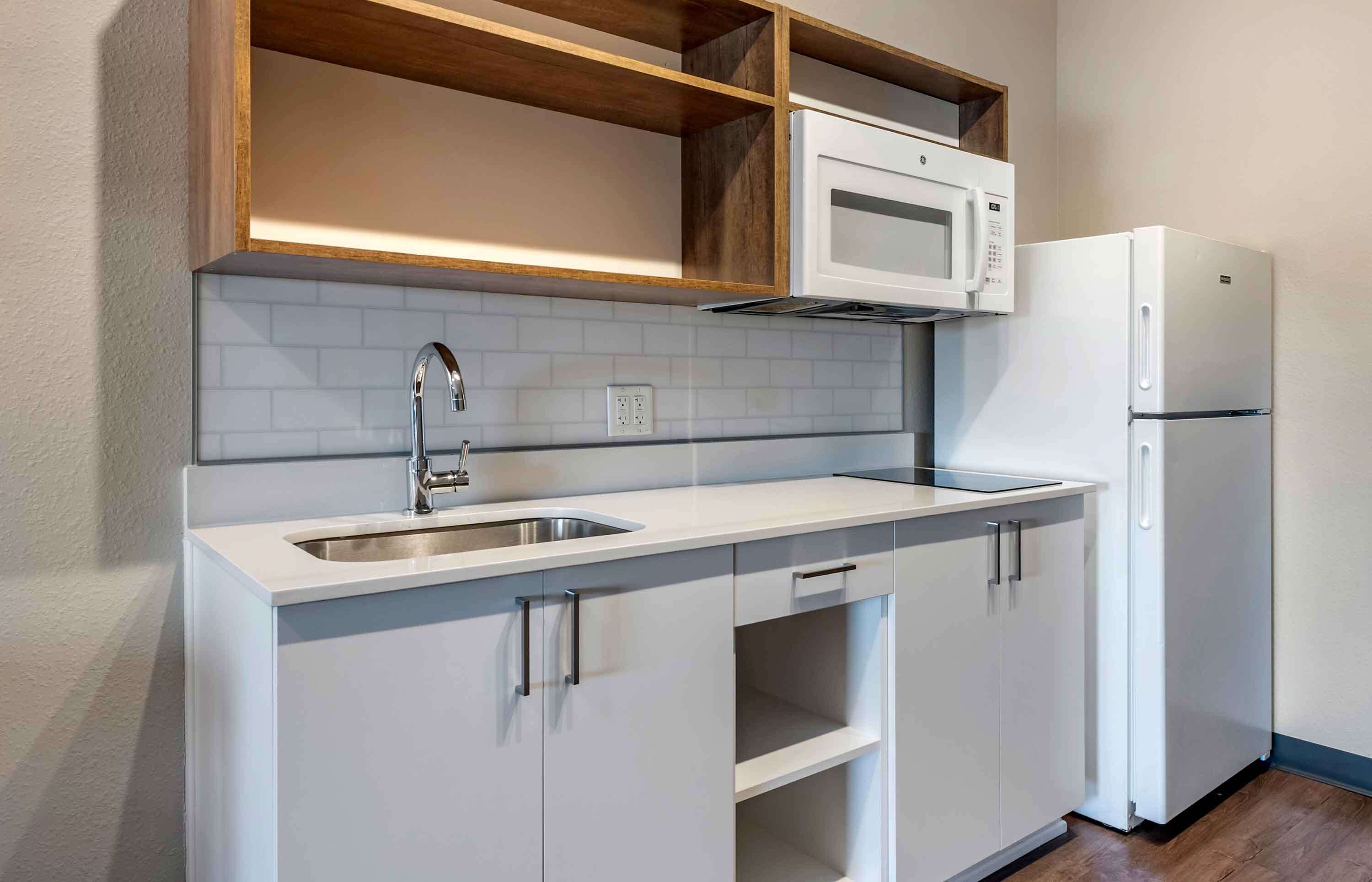 fridge, microwave, stovetop, cookware/dishes/utensils