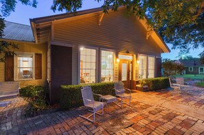 A building with a brick exterior, large windows, and a well-lit entrance. - Cottonseed Falls I River Access, Family fun (Martindale)