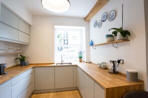 Three-Bedroom House | Private kitchen | Fridge, microwave, oven, stovetop