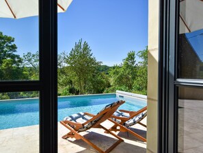 A heated pool, pool loungers