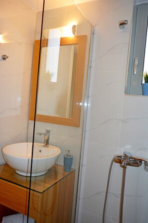 Hair dryer, towels, soap, shampoo