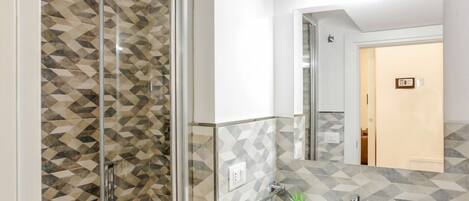 Shower, hair dryer, bidet, toilet paper