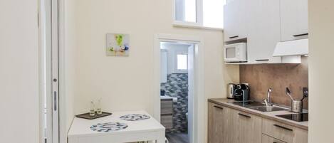 Microwave, stovetop, coffee/tea maker, electric kettle