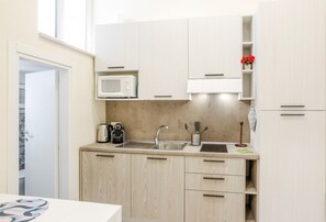 Microwave, stovetop, coffee/tea maker, electric kettle