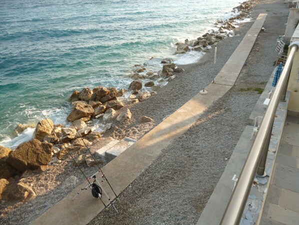 On the beach, sun-loungers - House next to the sea water (Derveni,Korinthia,Peloponnisos,Greece)