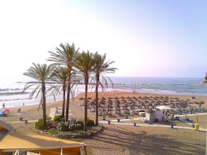 On the beach, sun-loungers