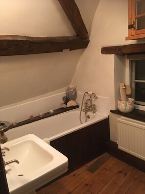 Bathtub, hair dryer, towels, soap