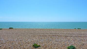 On the beach, sun-loungers