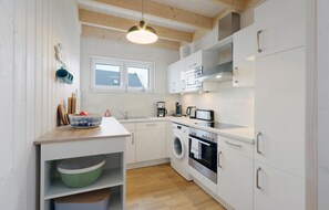 Fridge, stovetop, dishwasher, coffee/tea maker