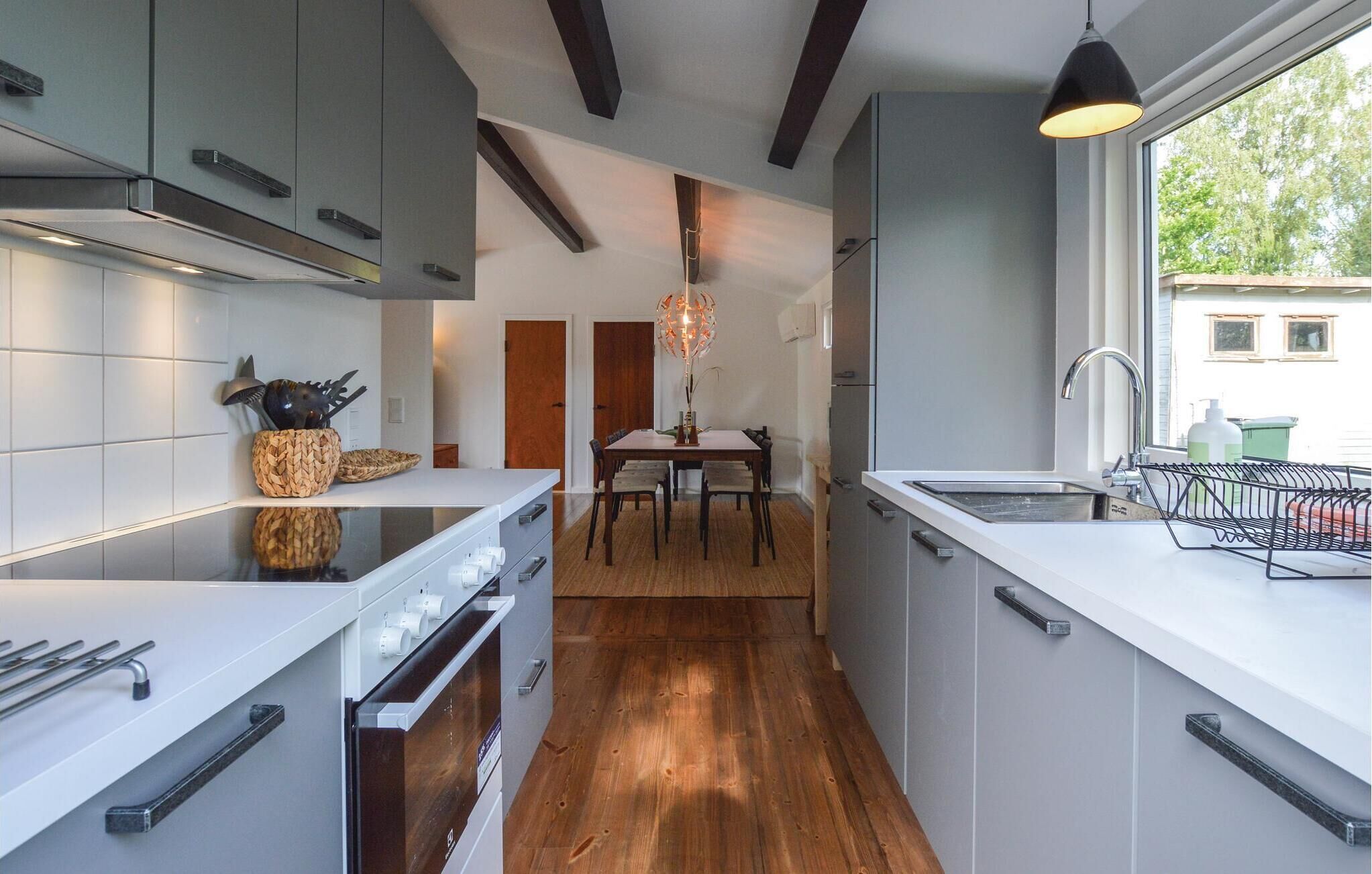 Fridge, stovetop, dishwasher, coffee/tea maker