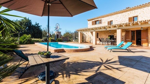 A poolside area with a pool, lounge chairs, and a patio table. - Finca Capote, private pool, WIFI, A/C, 3 bedrooms, 2.5 bathrooms, 6 persons (Buger)