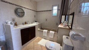 Bathtub, hair dryer, towels, soap