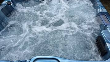 A hot tub with a digital temperature display.